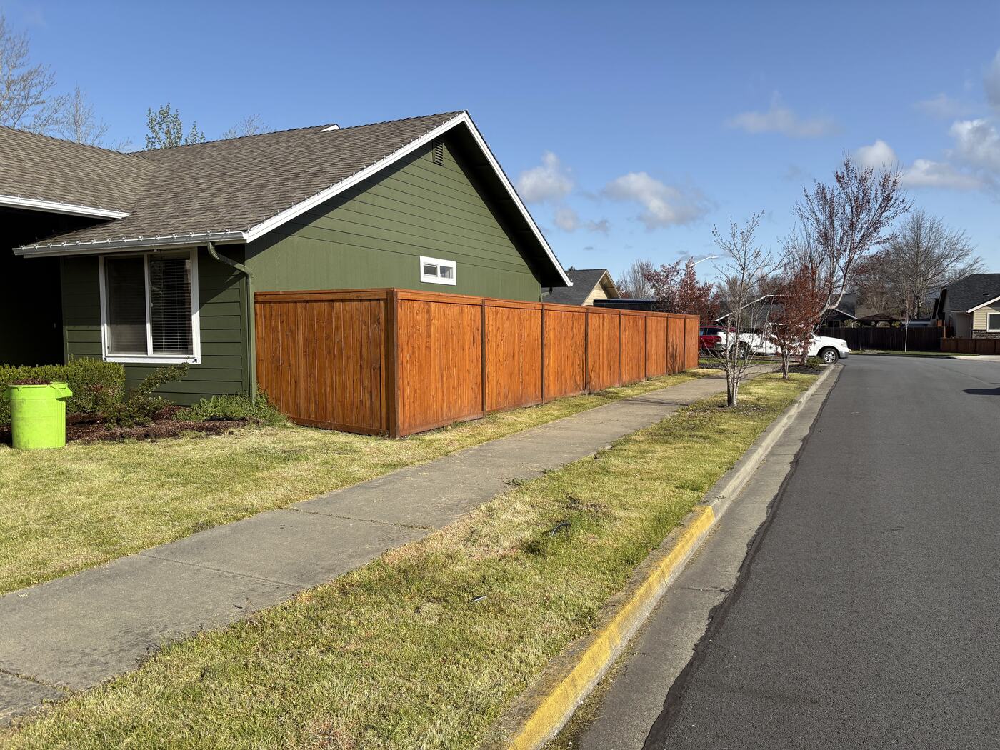 Before: grass and weeds in the sidewalk strip